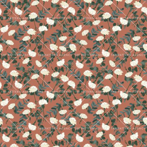A seamless pattern with white flowers and green leaves on a dark brown background. The flowers have five petals and are arranged in small clusters. The leaves are oval and have a toothed edge. The pattern is elegant and gives a feeling of nature and calm.